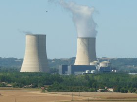 Golfech cooling towers with steam over fields