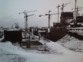 Gravelines cranes over snowy construction site
