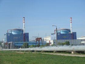 Khmelnitskiy two reactor buildings with pipes in grass