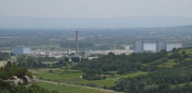 Marcoule site with tall stack in haze