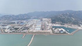 Tianwan port and plant buildings beside the sea